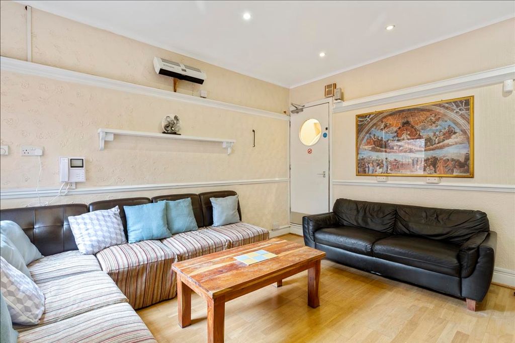 Property photo 1 of 12 Spacious Living Room Featuring Comfortable Seating...