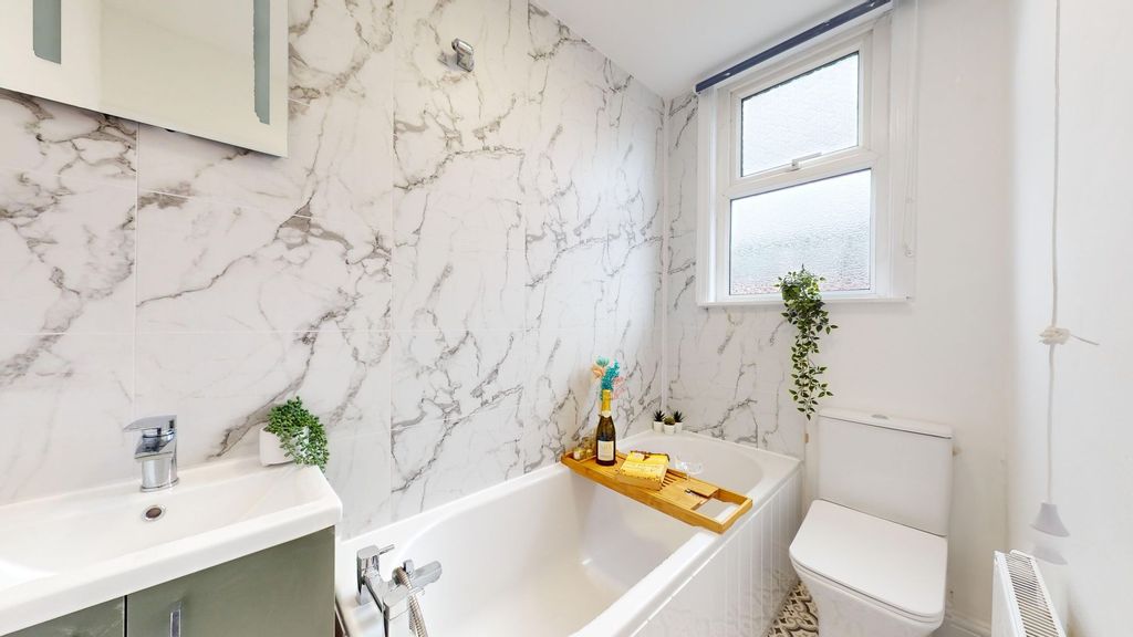 Property photo 1 of 12 This Beautifully Designed Bathroom Features Elegan...