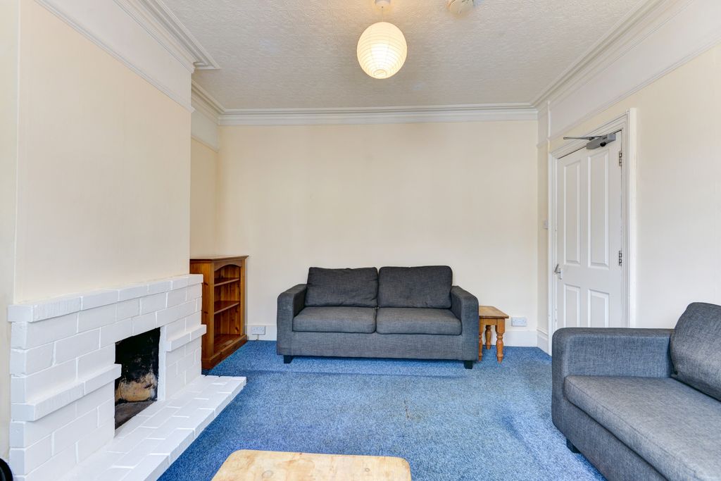 Property photo 1 of 16 A Comfortably Furnished Living Room Featuring A cl...