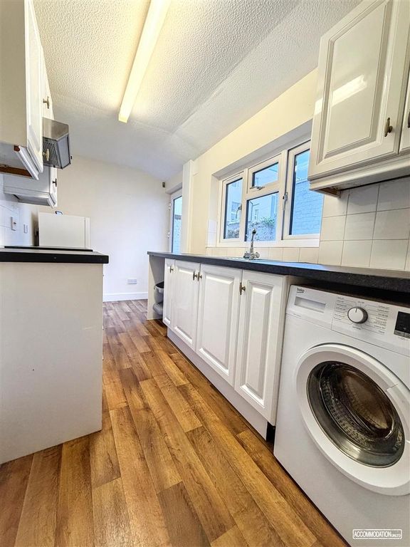 Property photo 3 of 8 Bright Galley Kitchen With Integrated Washer...