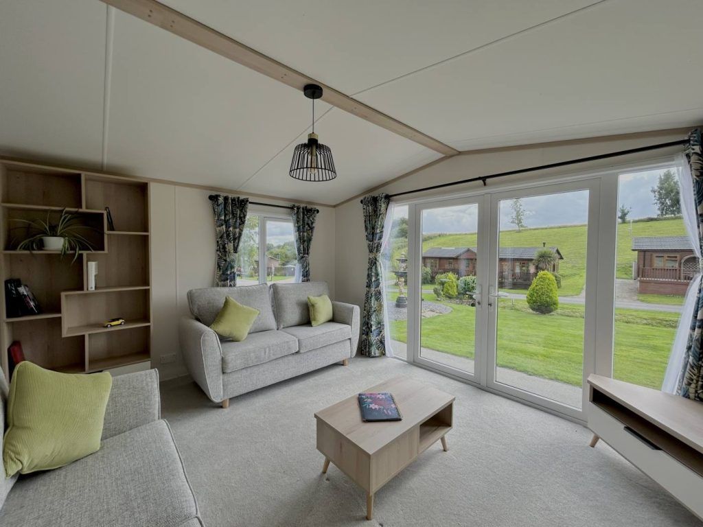 Property photo 3 of 12 Bright Regal Charmouth Lounge With Front Patio Doors And Countryside Views