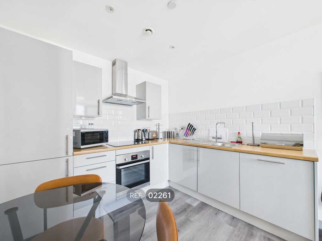 Property photo 1 of 12 Kitchen & Living Area
