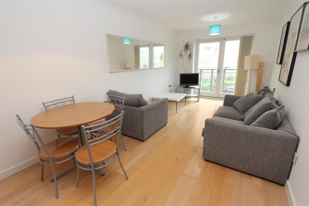 Property photo 1 of 10 Bright Living Area With Dining Set And Balcony...