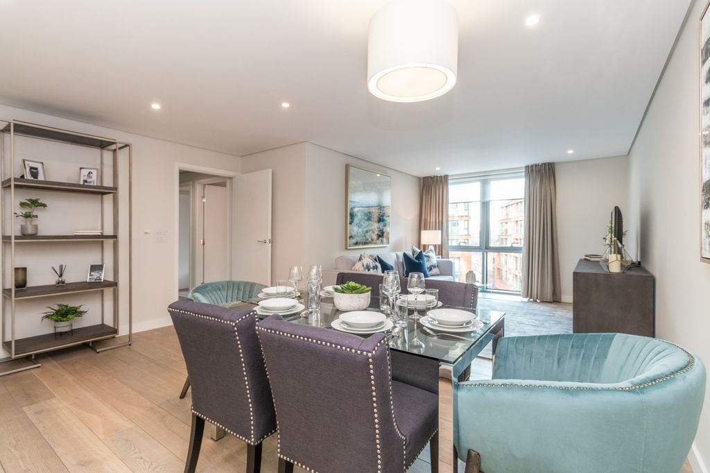 Property photo 3 of 13 Spacious And Modern Living Room With Ample Natural...