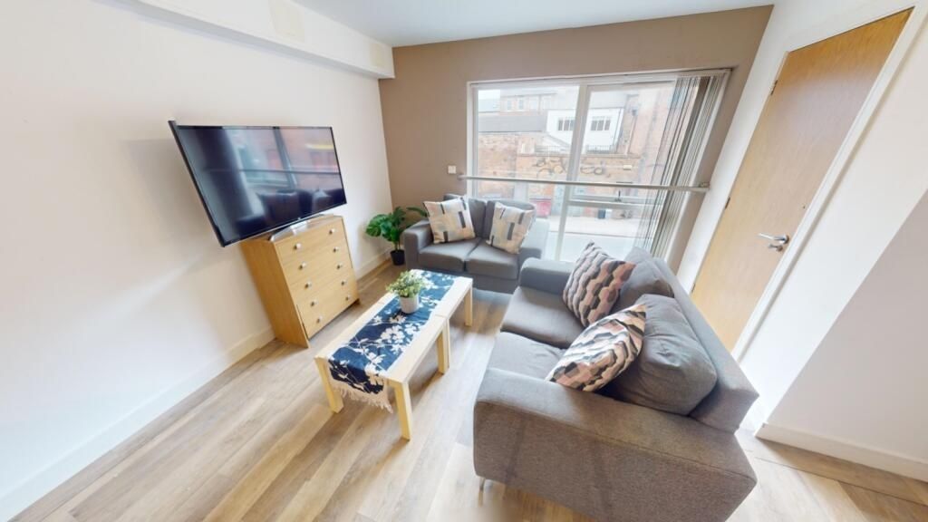 Property photo 2 of 13 Bright And Modern Living Room Featuring A Comforta...