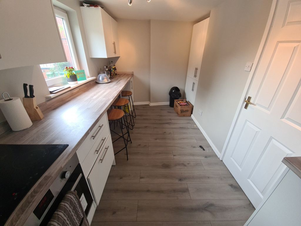 Property photo 3 of 18 Bright And Modern Kitchen Space Featuring Ample Na...