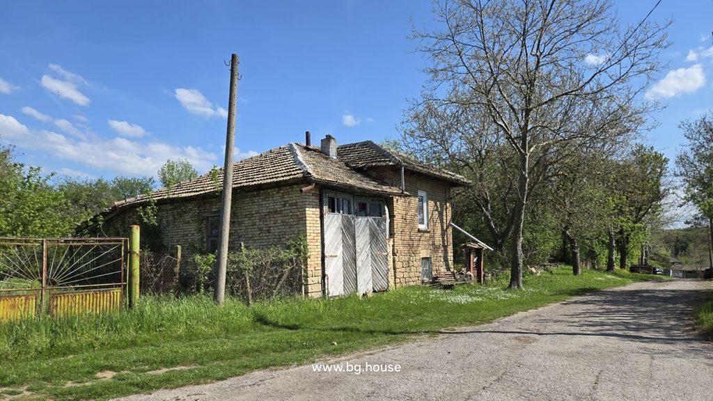 Property photo 3 of 49 Side View Of The Brick House With Wooden Double Doors And Trees Lining A Village Road