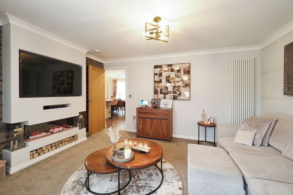 Property photo 2 of 20 Spacious Yet Cosy Living Room With French Doors And Feature Media Wall And Fire