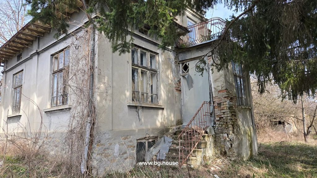 Property photo 3 of 48 Side View Of An Old House Showing Cracked Walls, Broken Windows, And Dry Vegetation Around