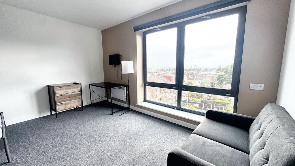 Property photo 3 of 9 A Bright, Modern Living Room With Large Windows Of...