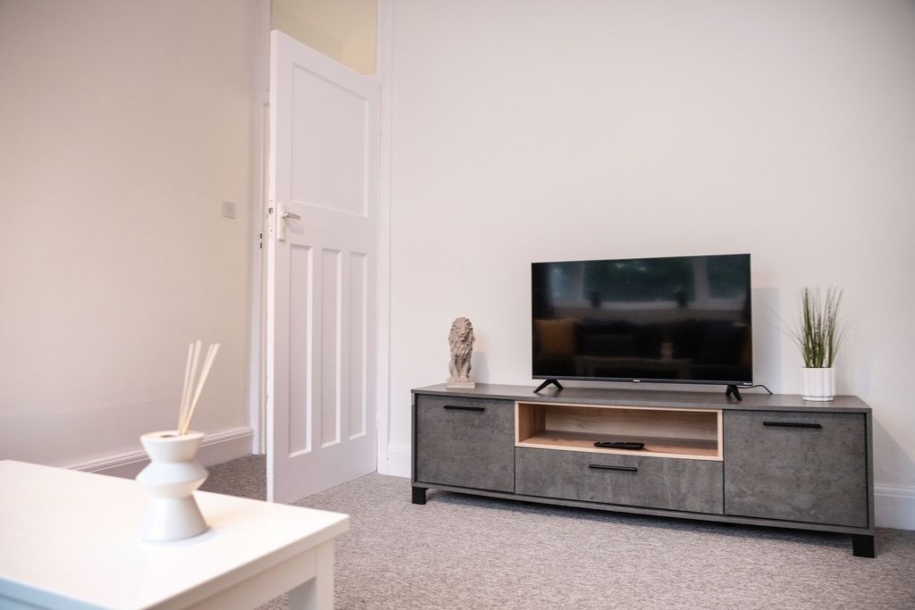 Property photo 2 of 14 Bright, Neutral Living Area With A Modern Media Un...