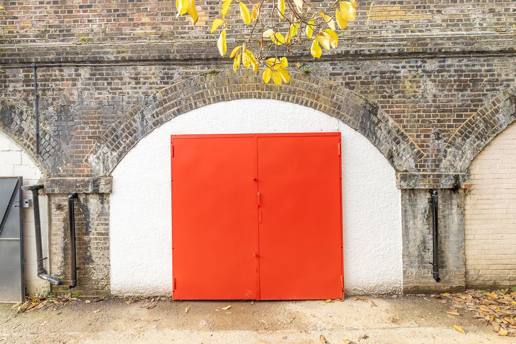 Property photo 1 of 3 The Front Of An Arch With A Closed Metal Concertina Door That Can Be Pulled Back Fully.