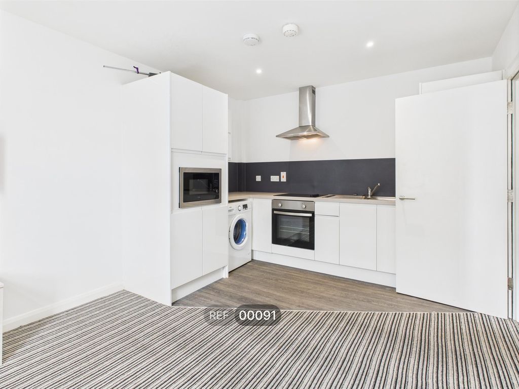 Property photo 1 of 12 Kitchen & Living Area