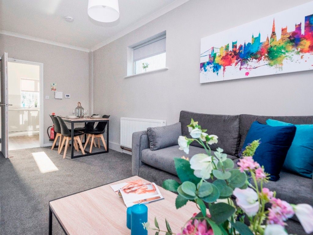 Property photo 2 of 9 A Vibrant Living Room Featuring A Cozy Sofa, A Sty...