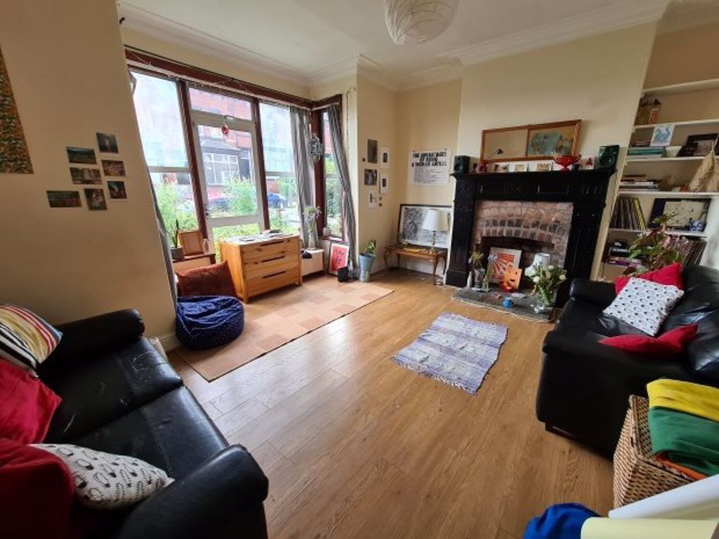 Property photo 3 of 13 A Spacious And Well-Lit Living Room Featuring Comf...