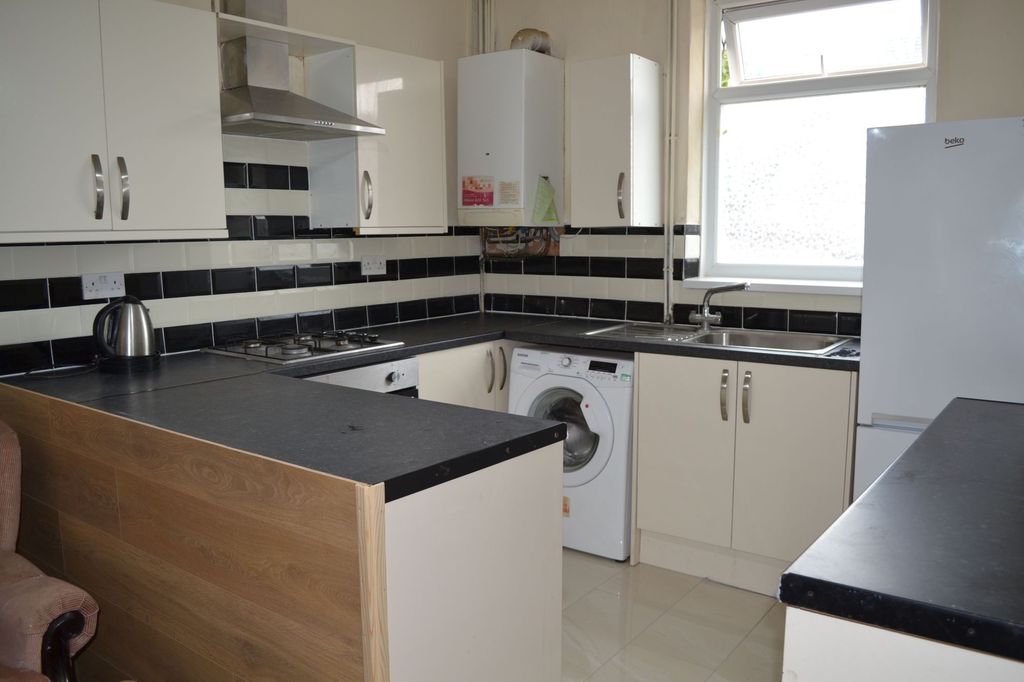Property photo 2 of 25 Bright, Modern Kitchen With White Cabinetry, Black...