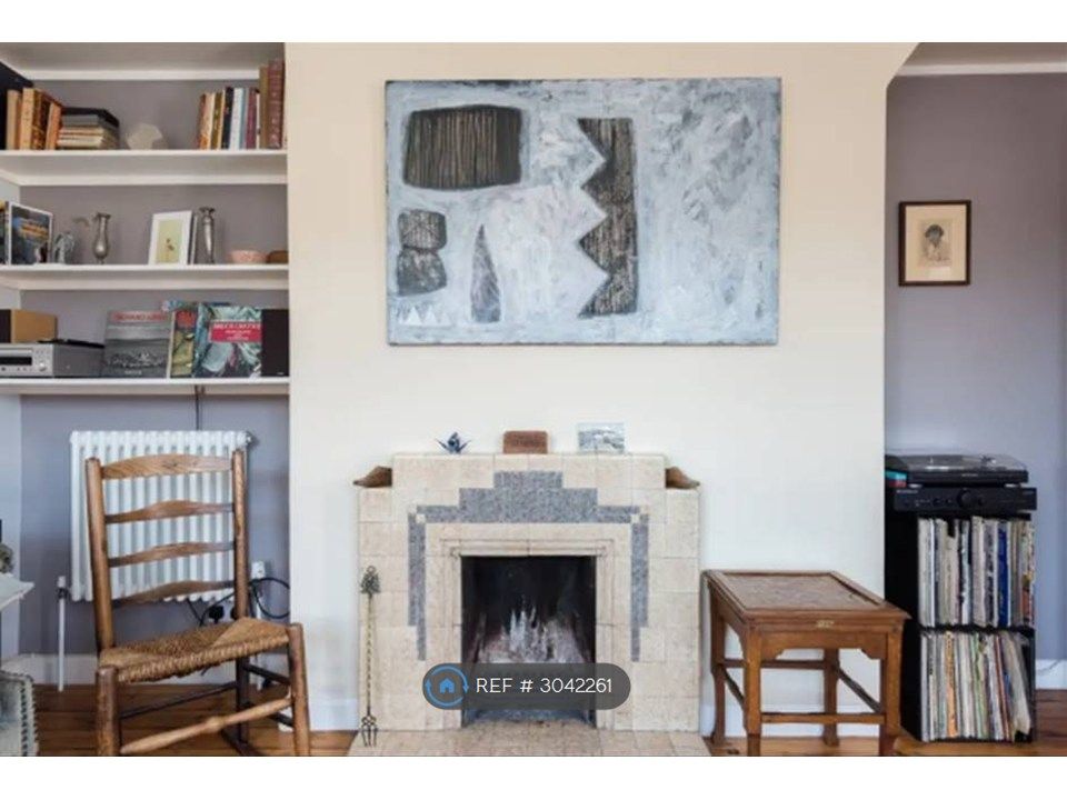 Property photo 3 of 8 Lounge With Fireplace