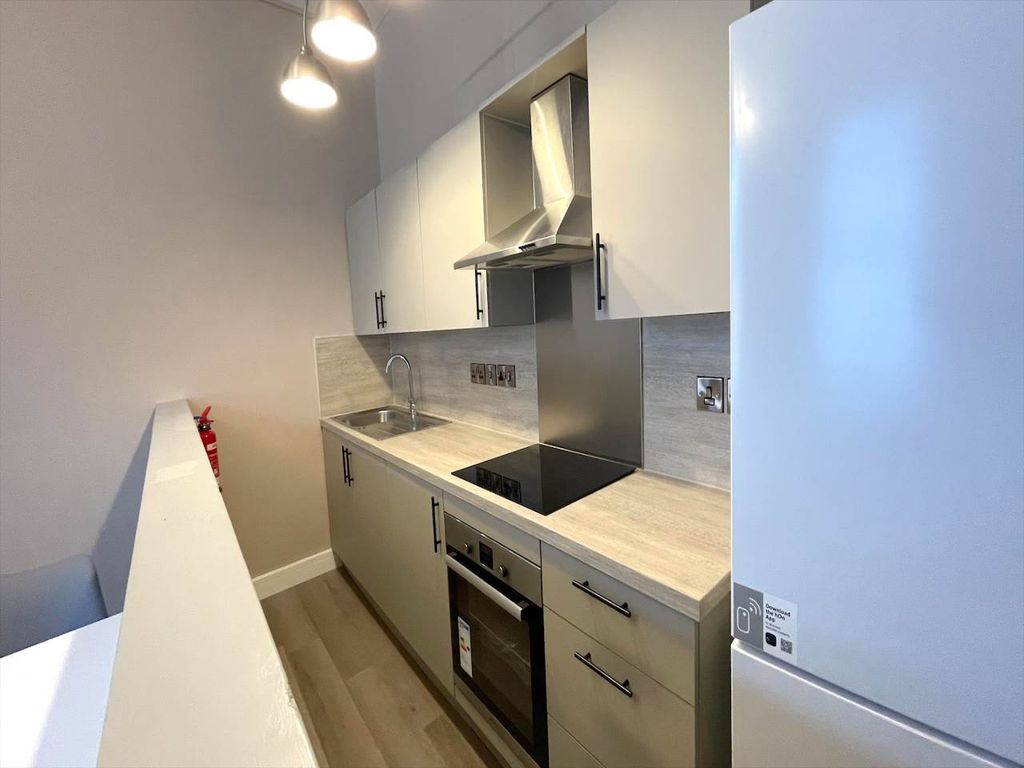 Property photo 3 of 8 Kitchen