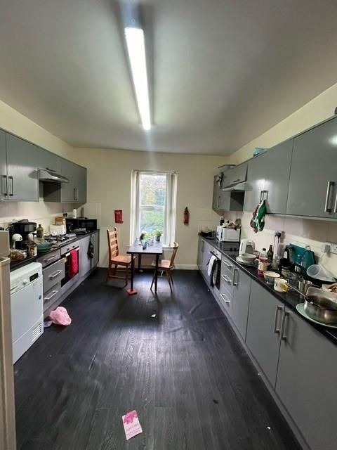 Property photo 2 of 9 A Well-Lit, Modern Kitchen With Ample Cabinetry An...