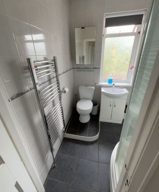 Property photo 2 of 6 A Modern, Well-Maintained Bathroom Featuring A Whi...