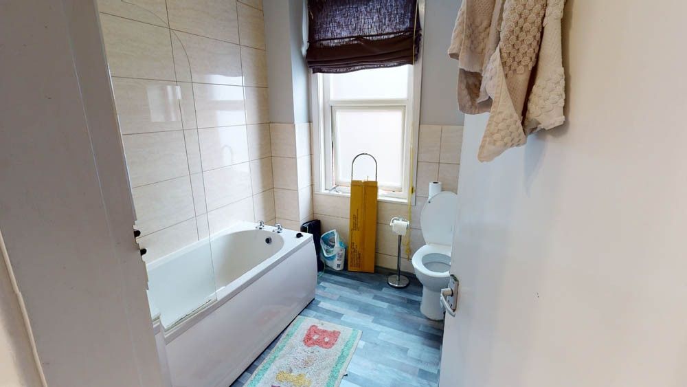 Property photo 2 of 10 Bright, Well-Kept Bathroom With A Full Bathtub, Ti...
