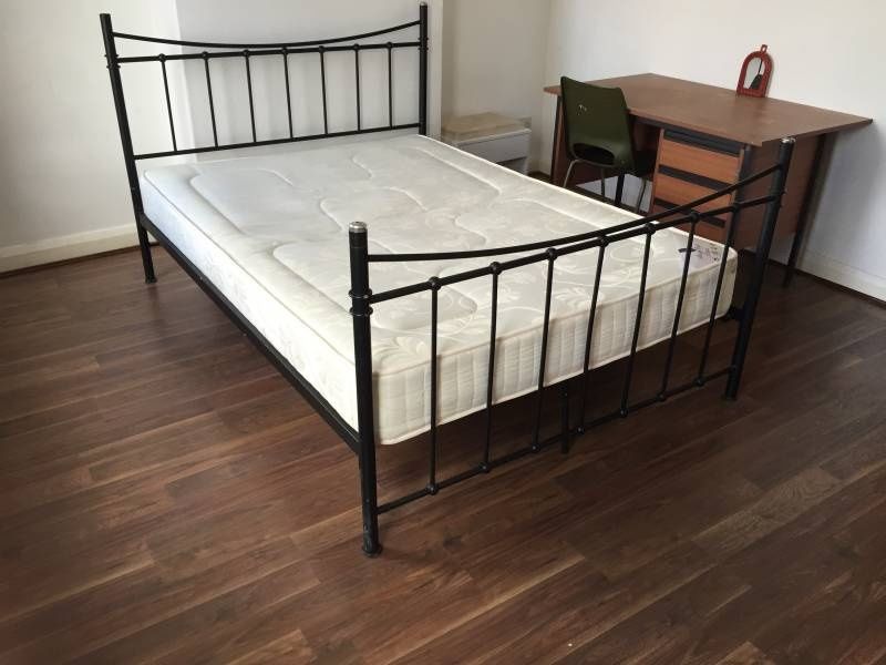 Property photo 2 of 8 Bright Bedroom With A Metal-Framed Double Bed, Cle...