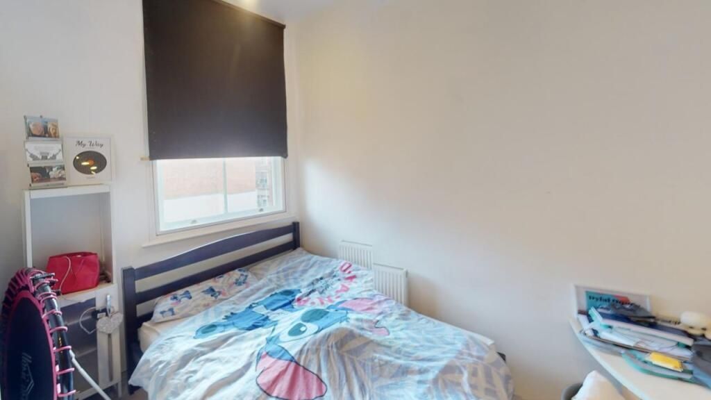 Property photo 1 of 15 A Cozy Single Bedroom Featuring A Neatly Made Bed,...