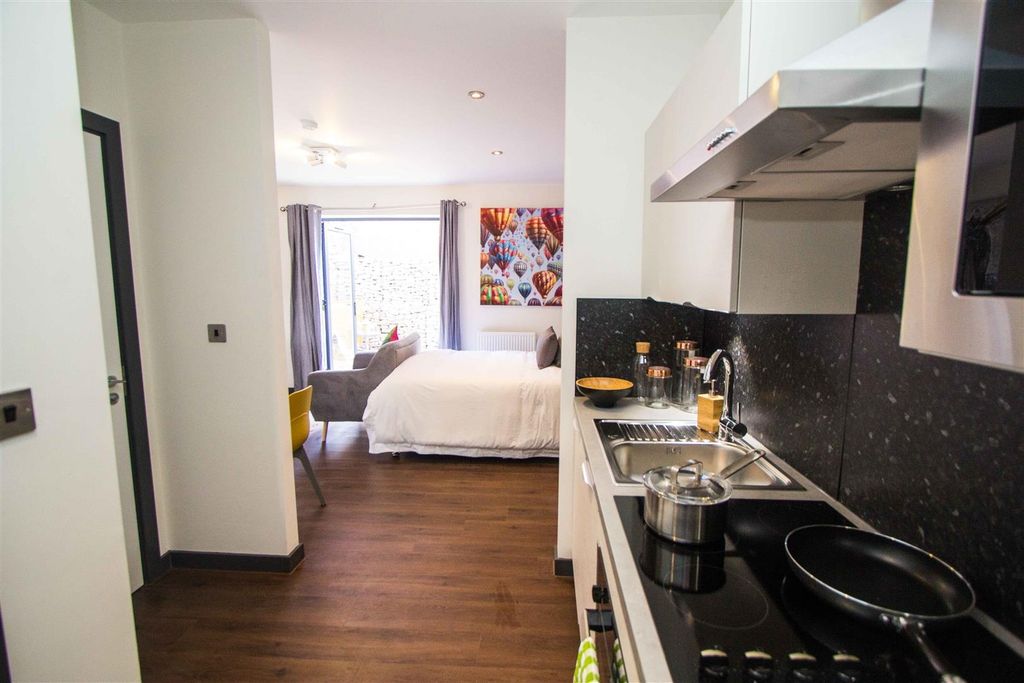 Property photo 3 of 5 Modern Studio With Sleek Kitchen And Living Area...