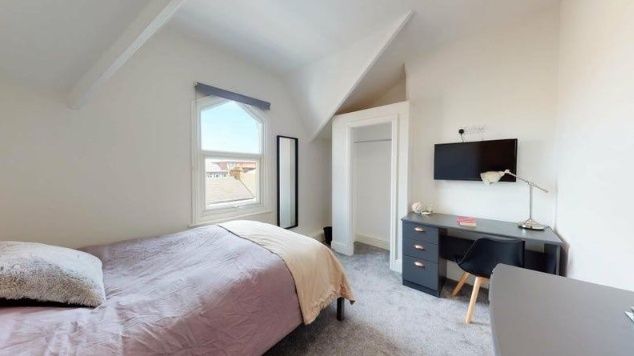 Property photo 3 of 8 A Bright Double Bedroom Featuring A Cozy Bed With ...