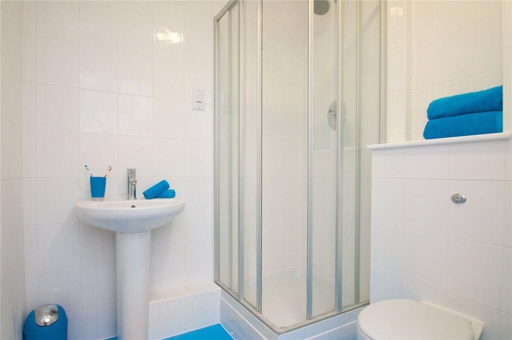 Property photo 1 of 3 Bright And Clean Bathroom Featuring A Modern Showe...
