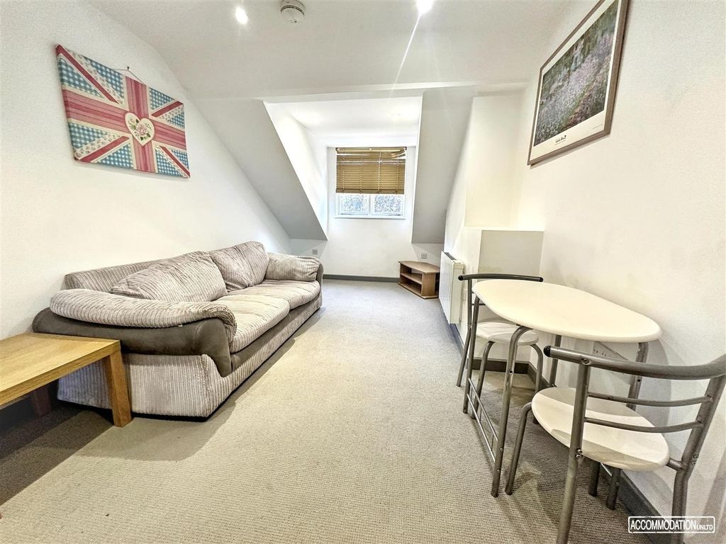 Property photo 2 of 6 Bright Lounge With Plush Sofa And Dining Area...