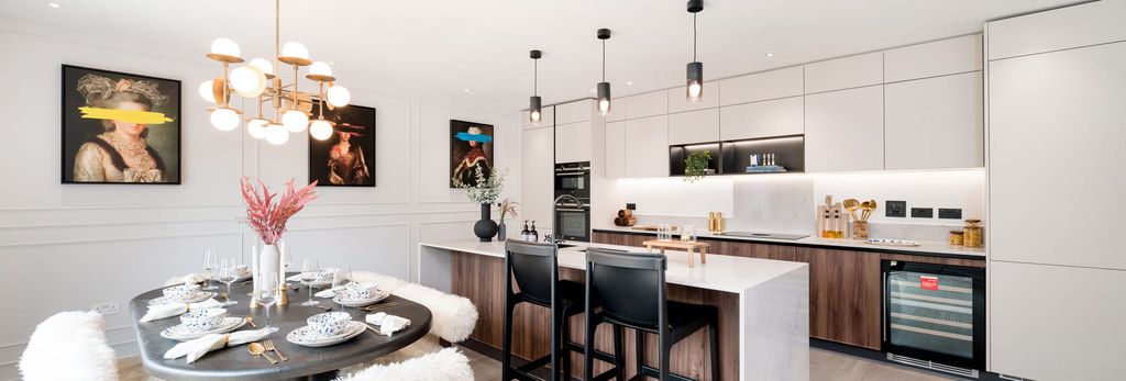 Property photo 3 of 4 Kitchen With Breakfast Island And Dining Table