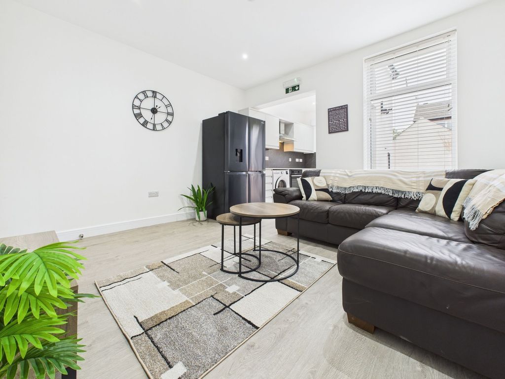 Property photo 1 of 13 Bright And Spacious Living Room Featuring Comforta...