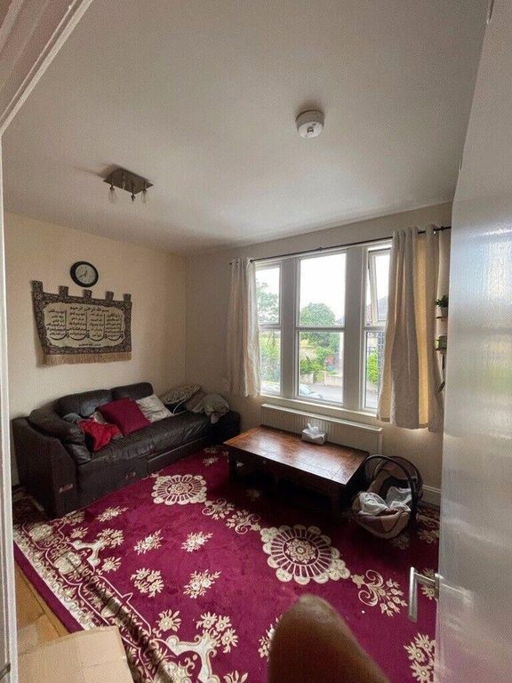 Property photo 2 of 7 Bright Living Room With A Large Front Window, Cozy...
