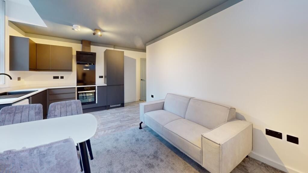Property photo 1 of 11 A Spacious And Modern Living Room Featuring Stylis...