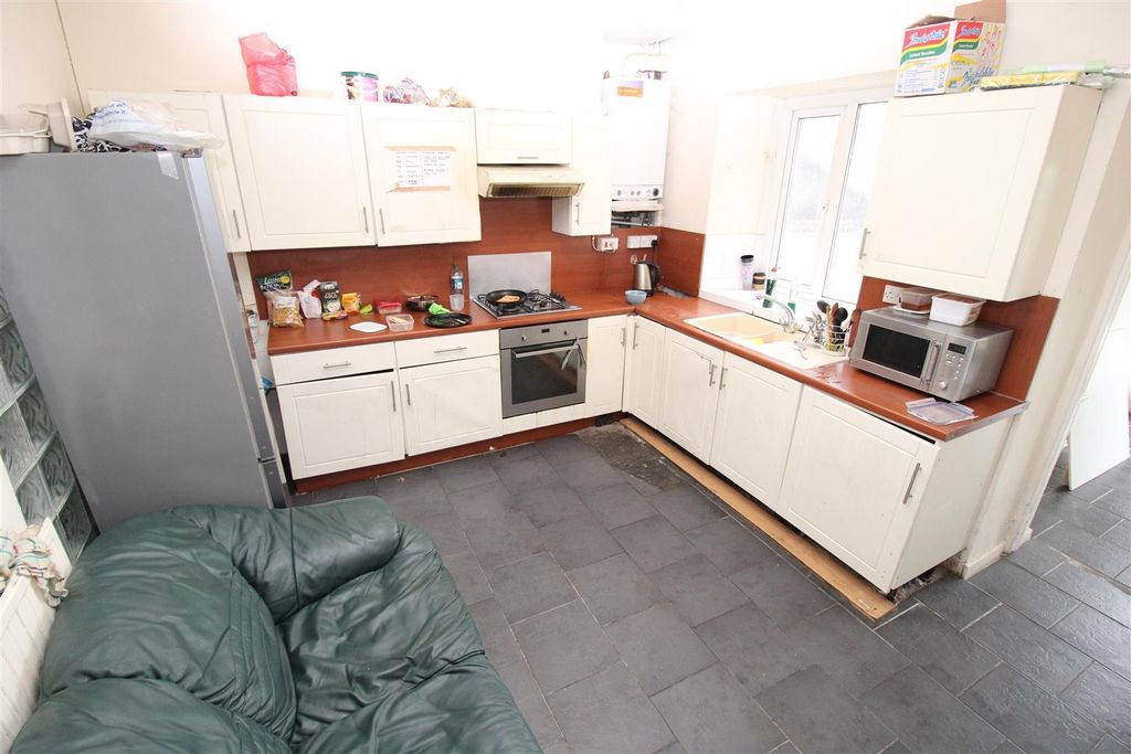 Property photo 1 of 5 Bright Kitchen With Ample Storage And Workspace...
