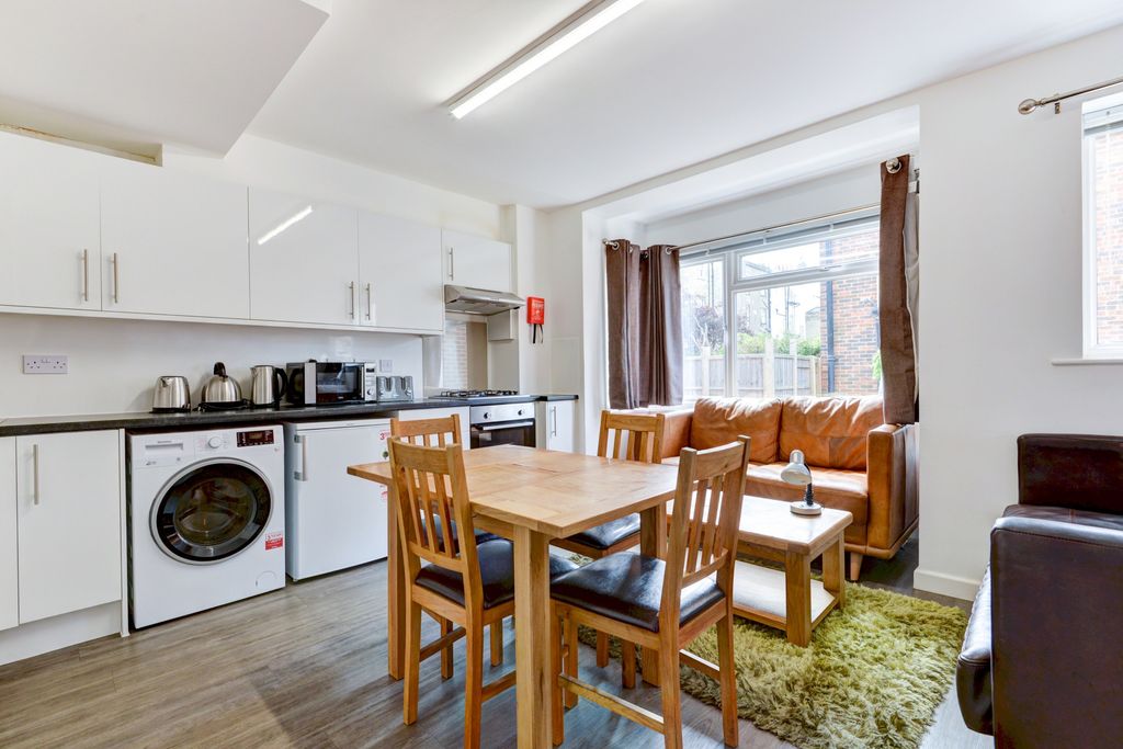 Property photo 1 of 10 Bright And Welcoming Living Room Featuring A Comfo...
