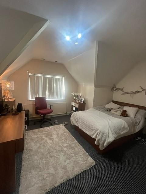 Property photo 1 of 13 A Spacious, Inviting Bedroom Featuring A Large Bed...