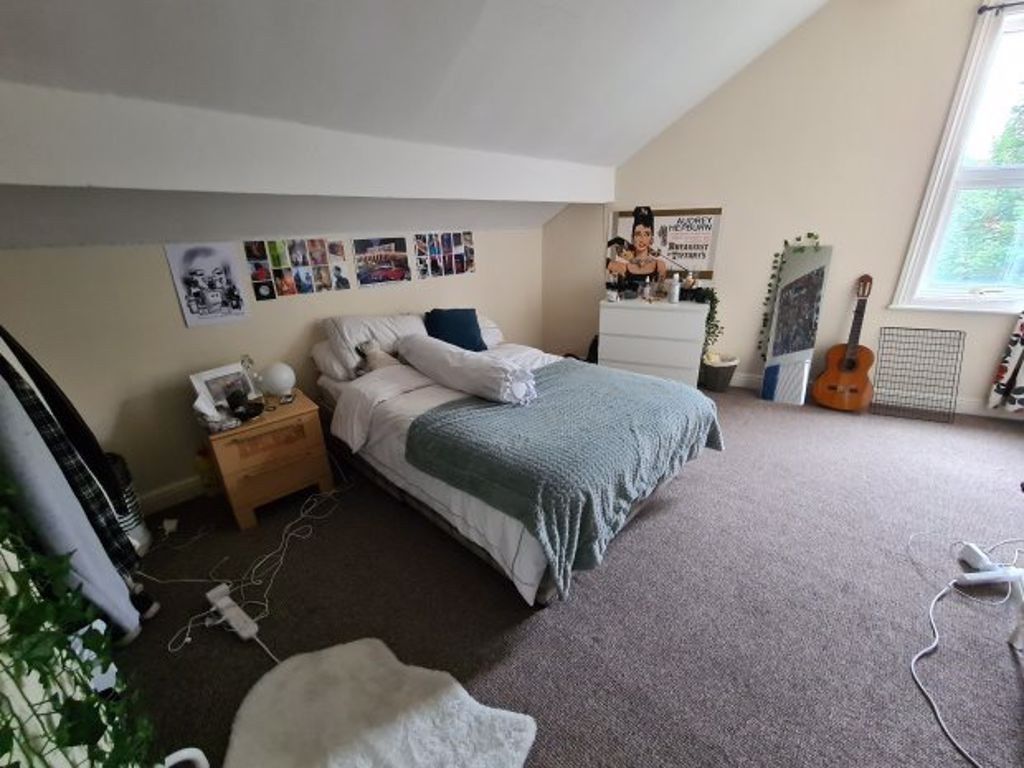 Property photo 1 of 22 A Spacious And Well-Lit Master Bedroom Featuring A...