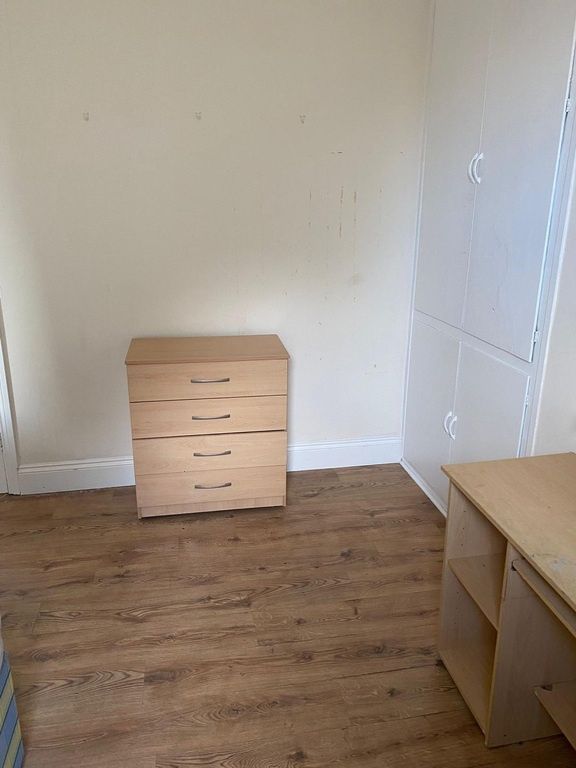 Property photo 3 of 3 Bright Bedroom With Wood Flooring And Storage...