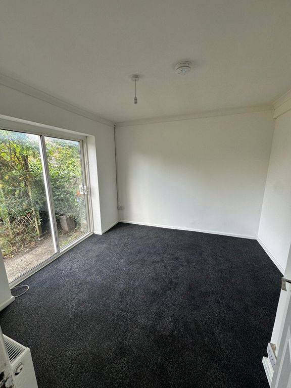 Property photo 2 of 15 Bright And Spacious Bedroom Featuring Large Slidin...