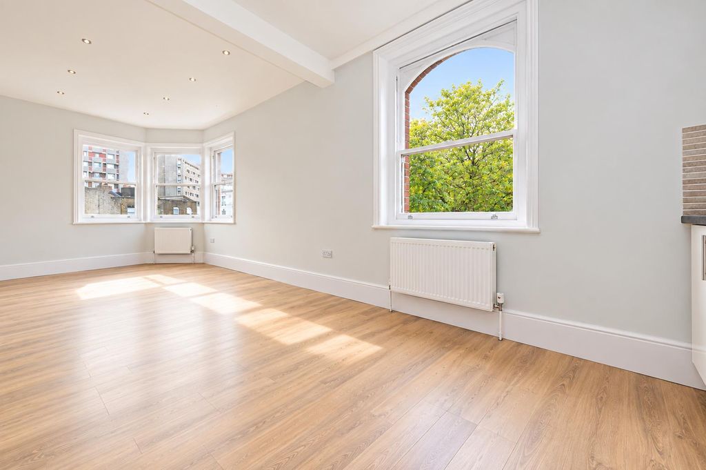 Property photo 3 of 10 Sunlit Minimalist Apartment Interior.Png