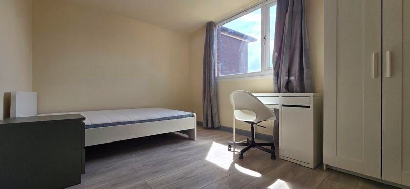 Property photo 2 of 6 A Well-Lit Bedroom Featuring A Comfortable Bed And...