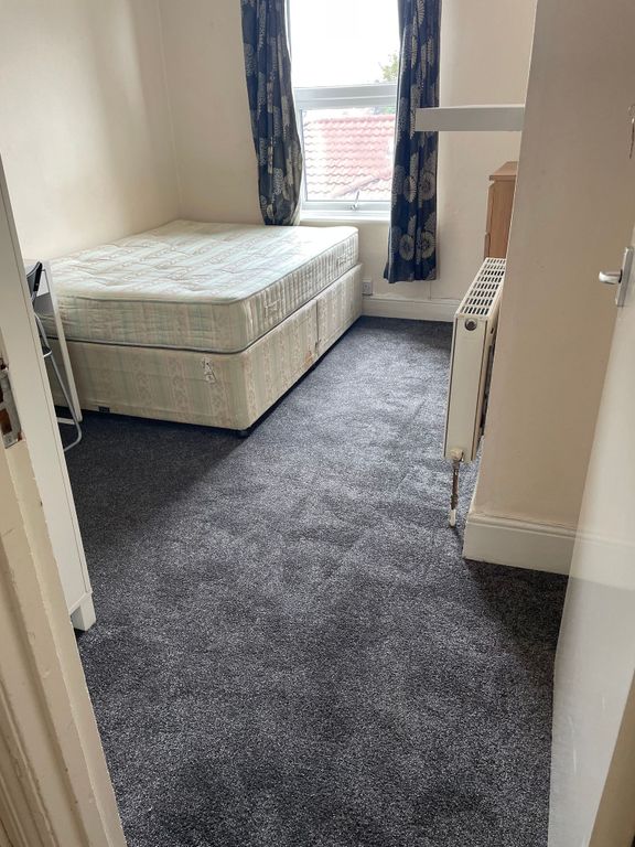 Property photo 3 of 5 A Modest Bedroom Featuring A Single Bed With A Pat...