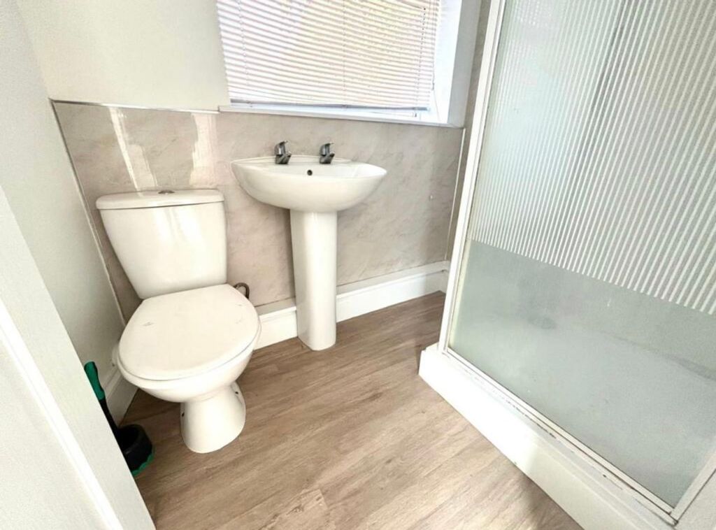 Property photo 2 of 13 A Modern And Clean Bathroom Featuring A Refreshing...