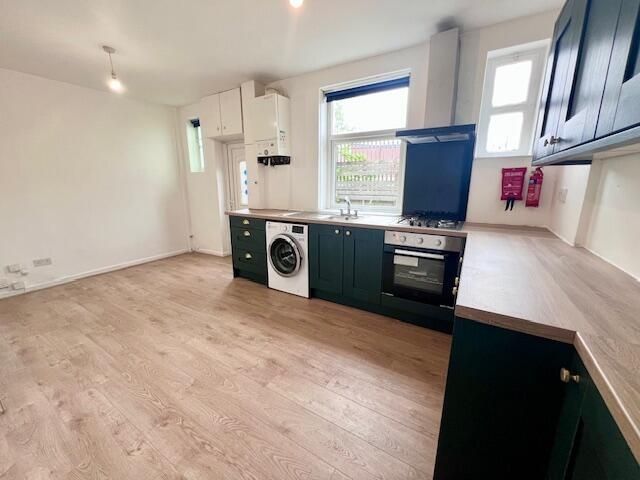 Property photo 2 of 9 Bright And Modern Kitchen Featuring Ample Counter ...