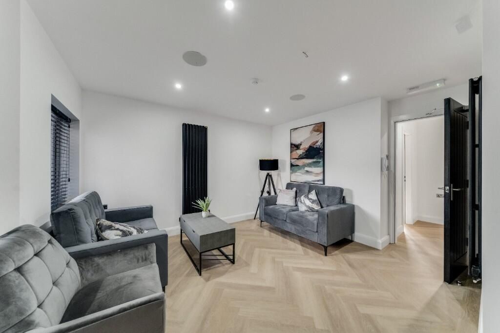 Property photo 1 of 11 A Modern, Well-Lit Living Room With Stylish Furnit...