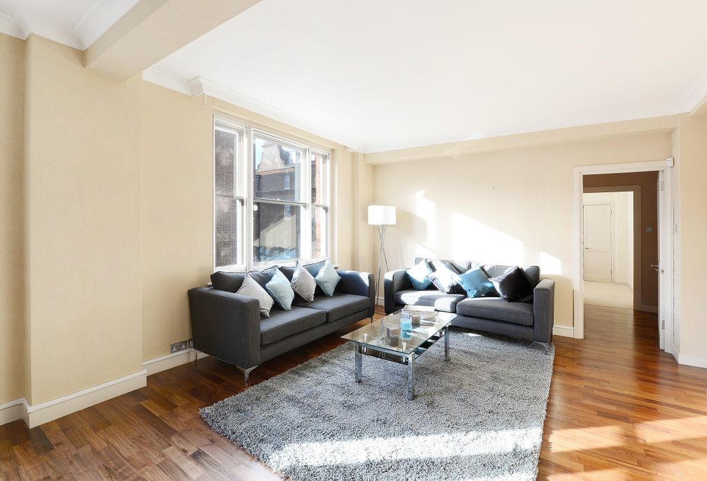 Property photo 2 of 17 This Spacious Living Room Features Large Windows T...