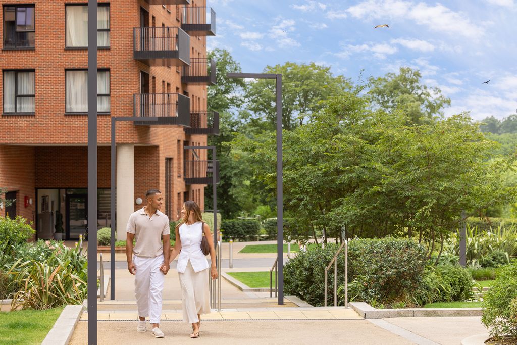 Property photo 2 of 6 Couple Walking Outside