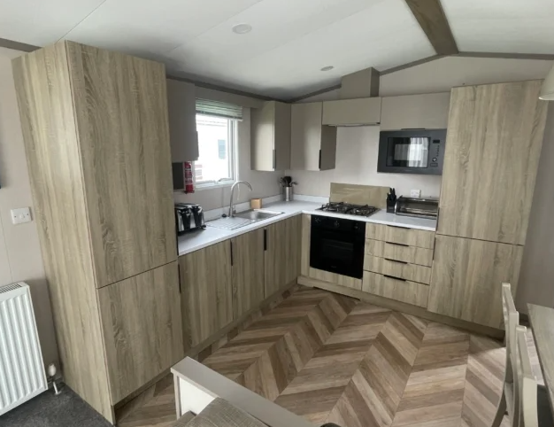 Property photo 3 of 12 Modern Fitted Kitchen With Integrated Appliances And Wood Effect Cabinets